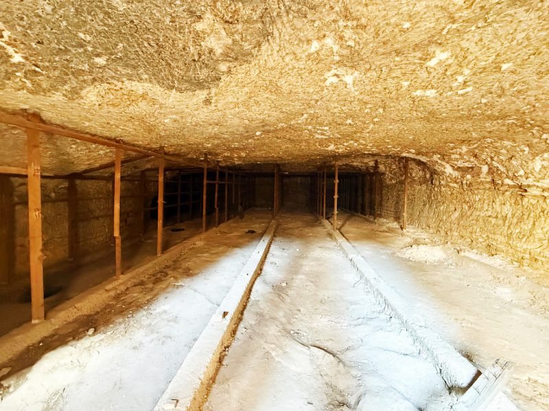 A shadowed stone cave interior