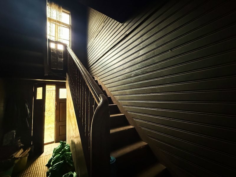 A dim, worn stairwell