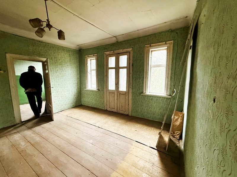 A quiet room with green walls