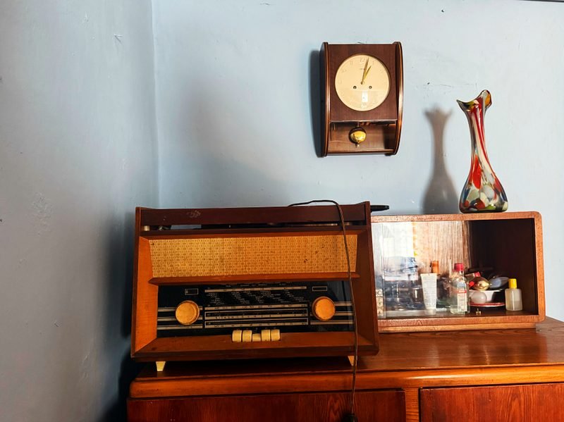 An old radio cabinet in a dark room