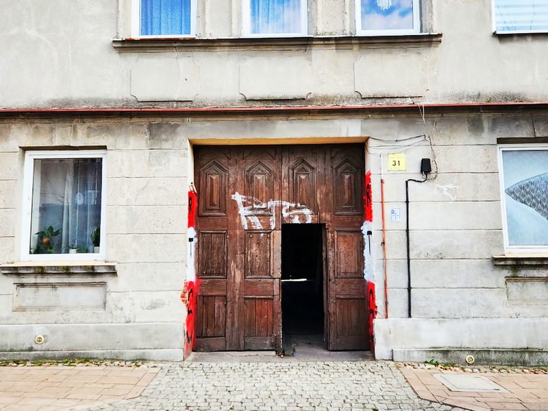 An old brick doorway on a narrow street