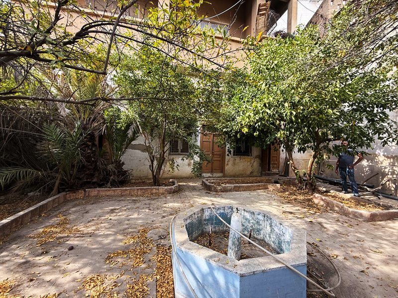 A stone well in a courtyard